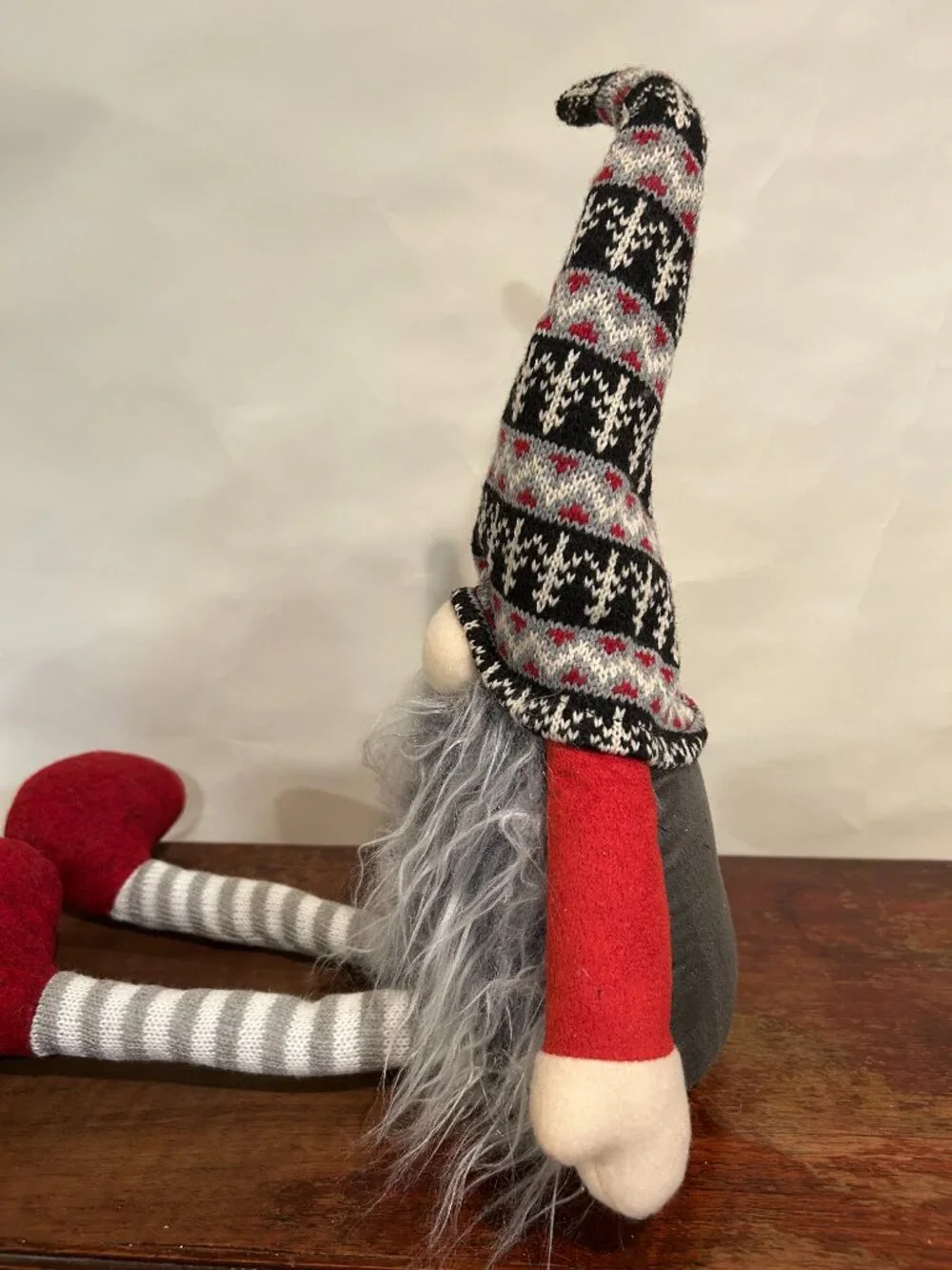 Christmas Holiday Gnome with knit cap, striped stockings and wispy gray beard